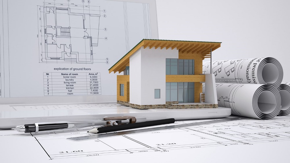 Planta de casa e miniatura. Imagem ilustrativa para texto habitação de interesse social.